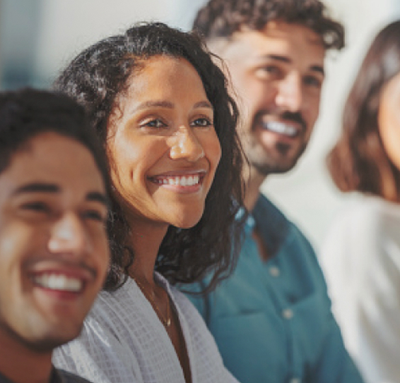 Close-up of three smiling people