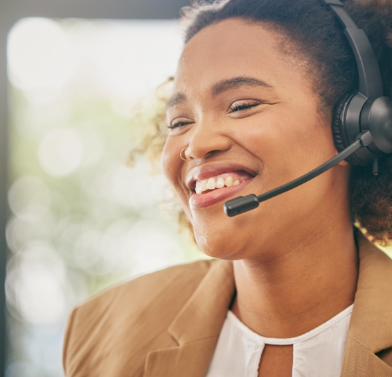 Person smiling while wearing a headset.