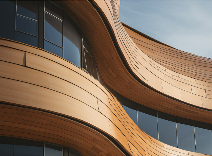 Close-up view of a modern building with curved wooden panels and dark windows.