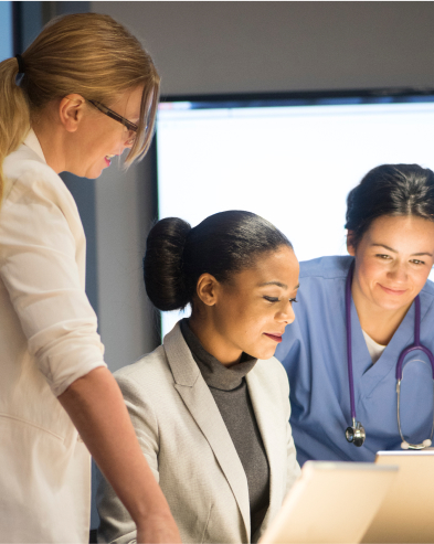 A group of medical professionals looking over some documents