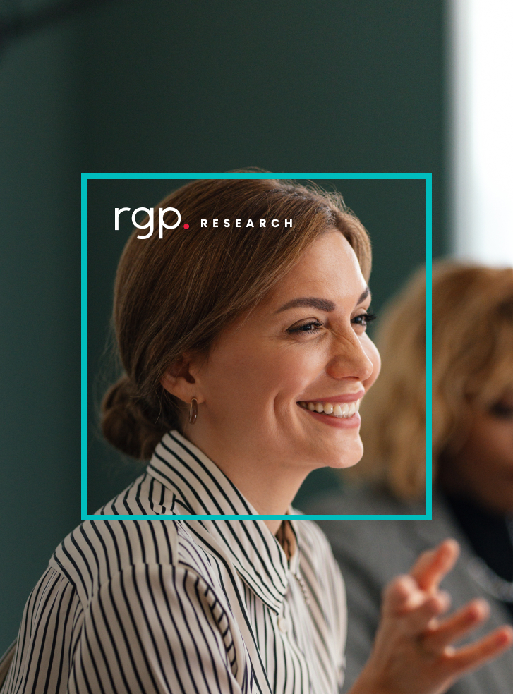 A woman smiling in a meeting