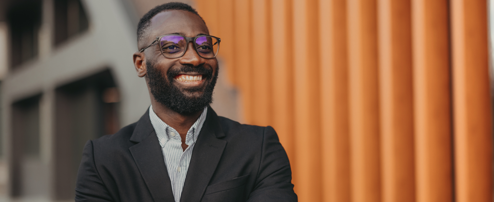 Smiling man in suit and glases