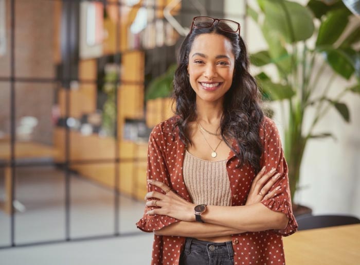 Woman smiling with arms crossed