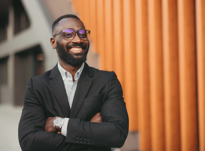 Smiling man in suit and glases