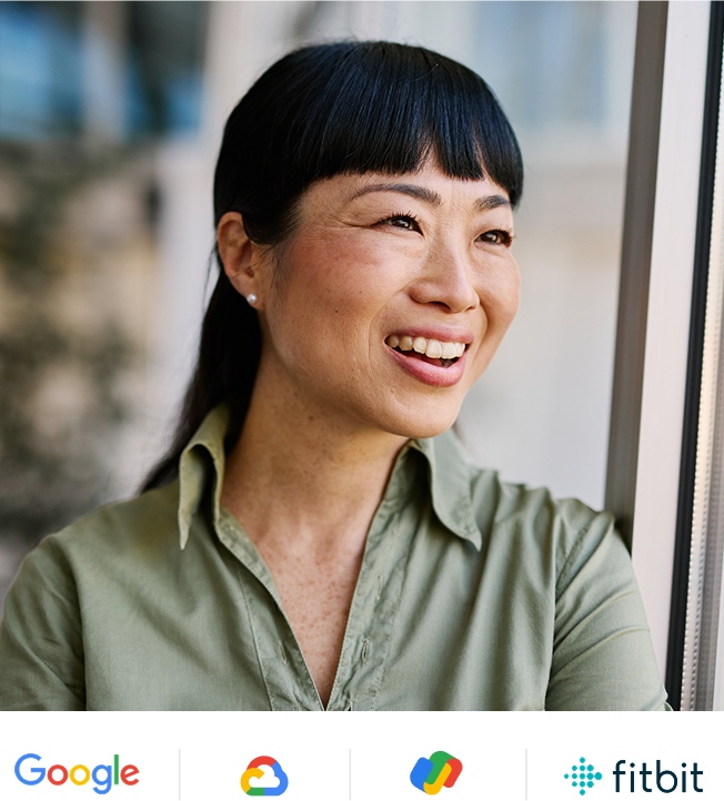 Woman in green button up shirt smiling