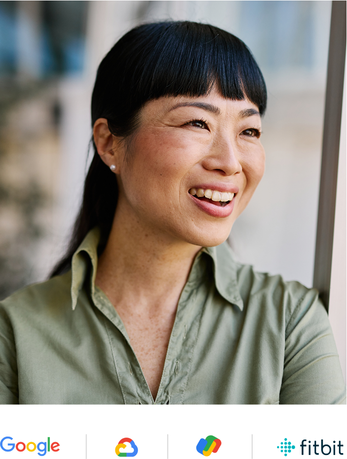 Woman in green button up shirt smiling