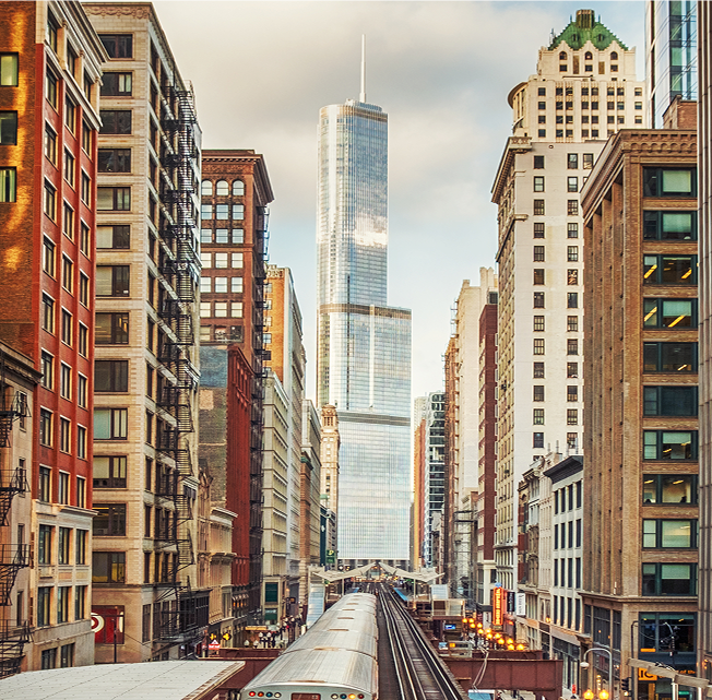 city skyscraper with train