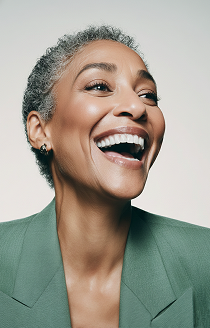 A laughing professional woman